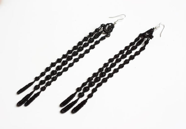 Boucles d'oreilles Seagrass élégantes, réalisées à la main avec des perles vertes évoquant la beauté de la mer.